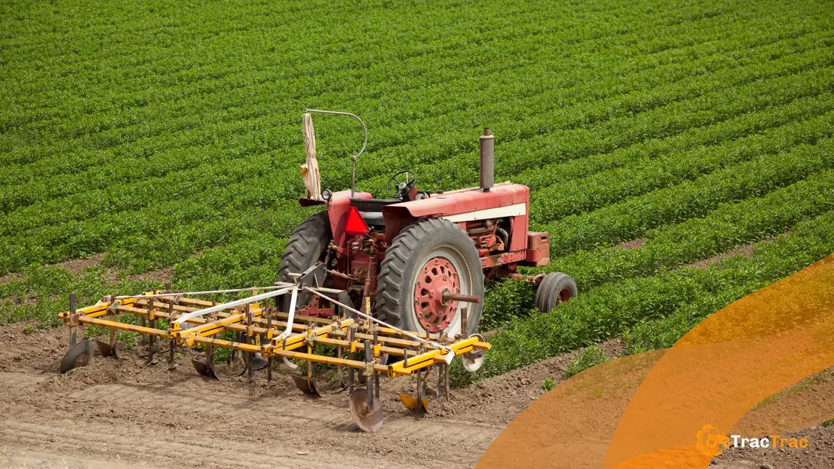 Tractor on a field with implement attached
